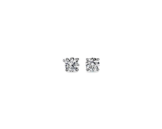 Round diamond studs in white gold setting.