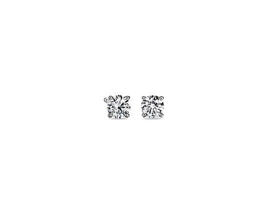 Round diamond studs in white gold setting.