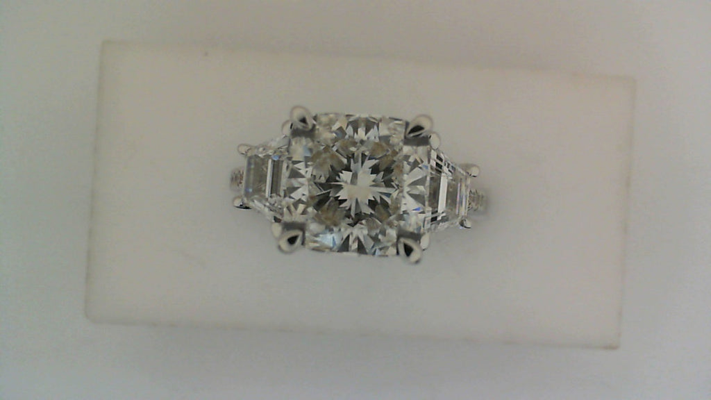 Cushion-cut diamond ring in white gold.