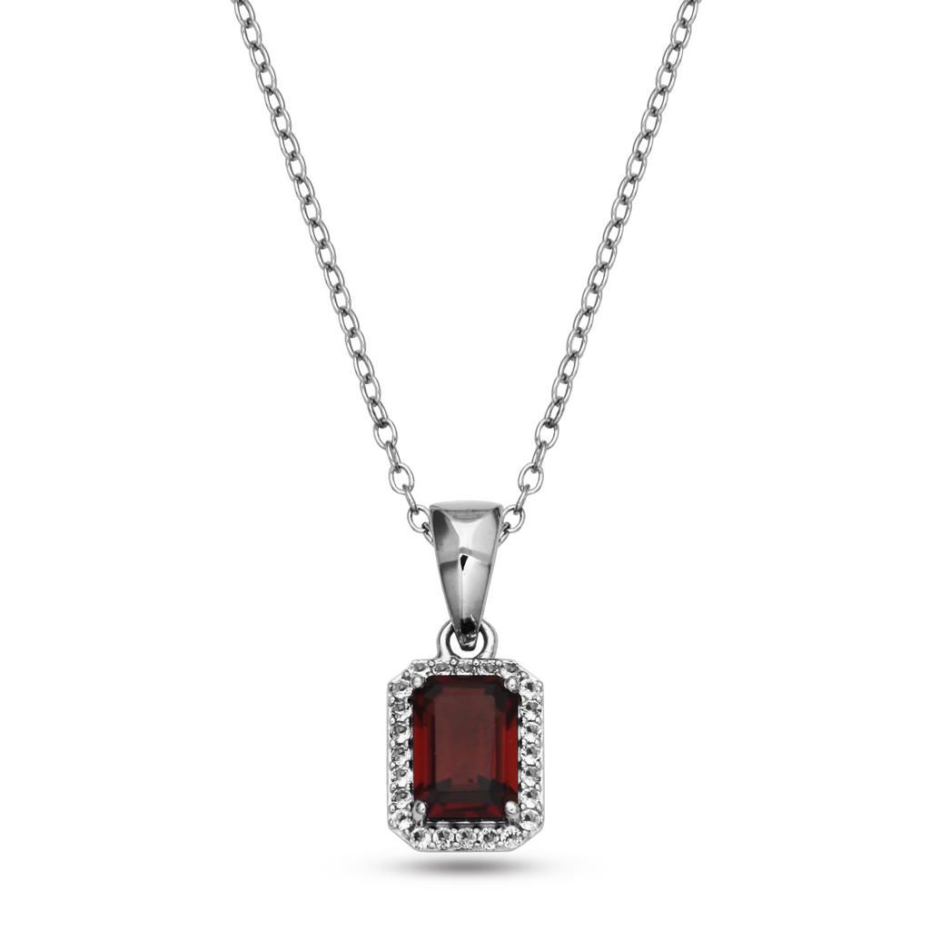 Emerald garnet pendant with white topazes.