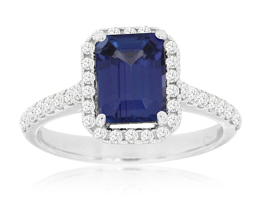 Emerald-cut tanzanite ring with diamond halo.