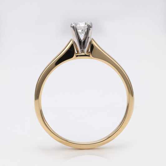 Diamond solitaire ring, platinum and yellow gold.