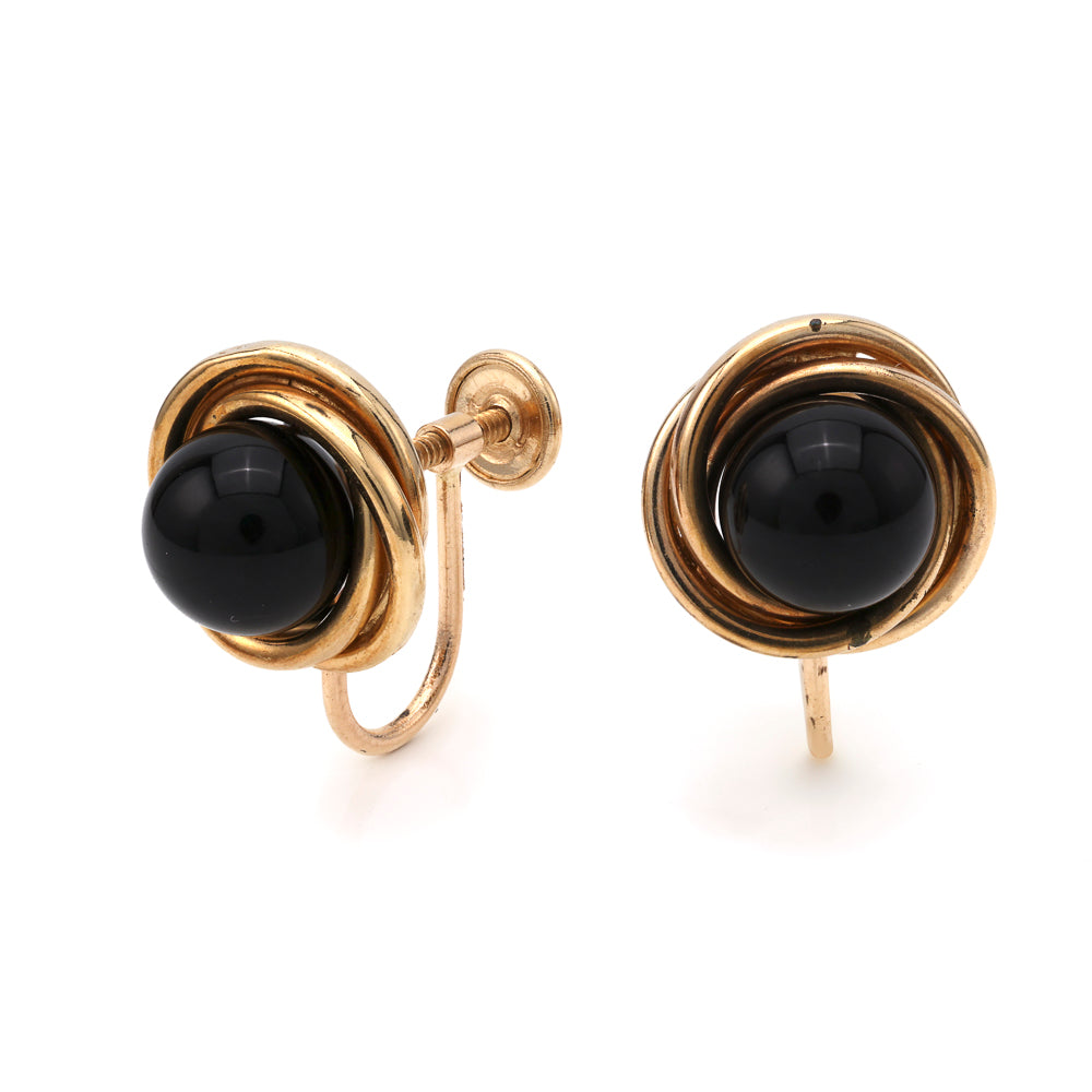 Cabochon onyx earrings in yellow gold setting.