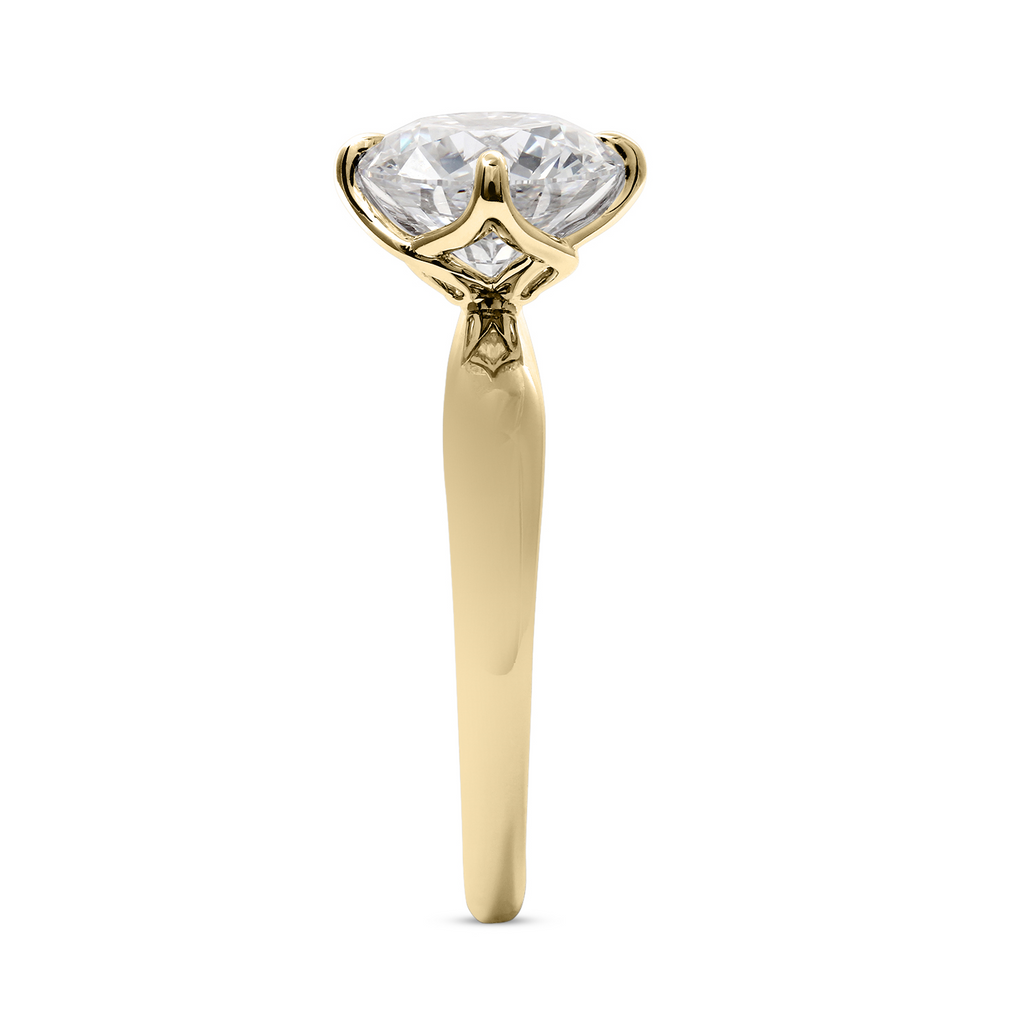 Yellow gold solitaire engagement ring with diamond.