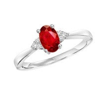 Oval garnet ring with diamonds in white gold.