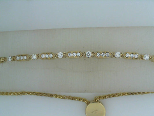 14K yellow gold bracelet with round diamonds.