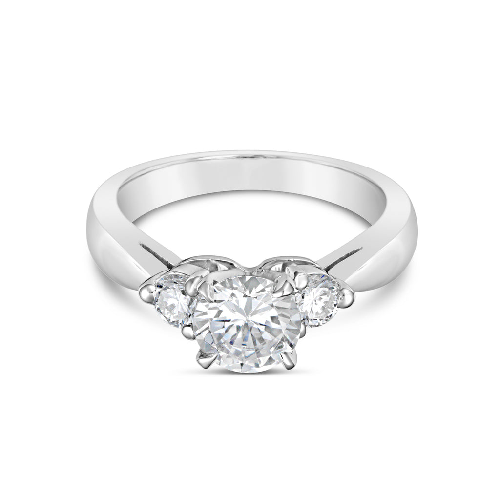 Three-stone diamond ring in platinum setting.