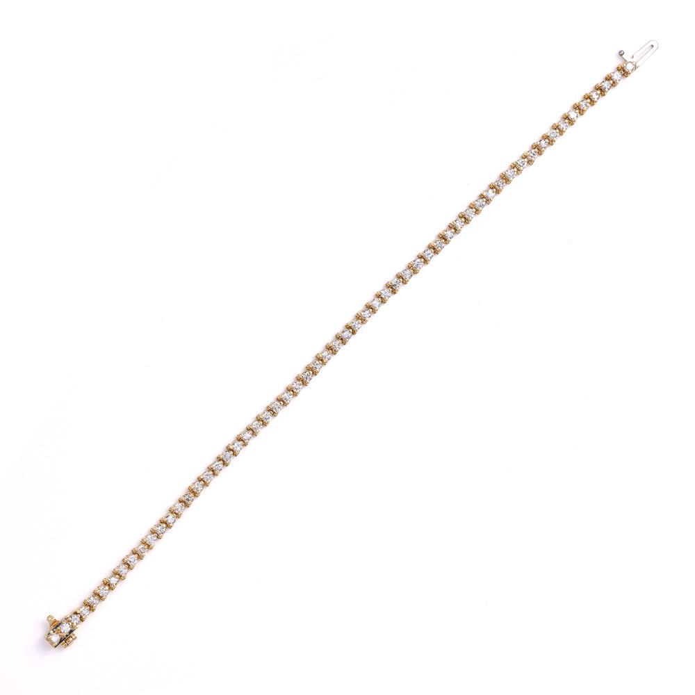 14K yellow gold diamond tennis bracelet.