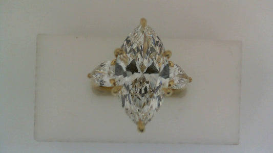 Three-stone marquise diamond ring in gold.