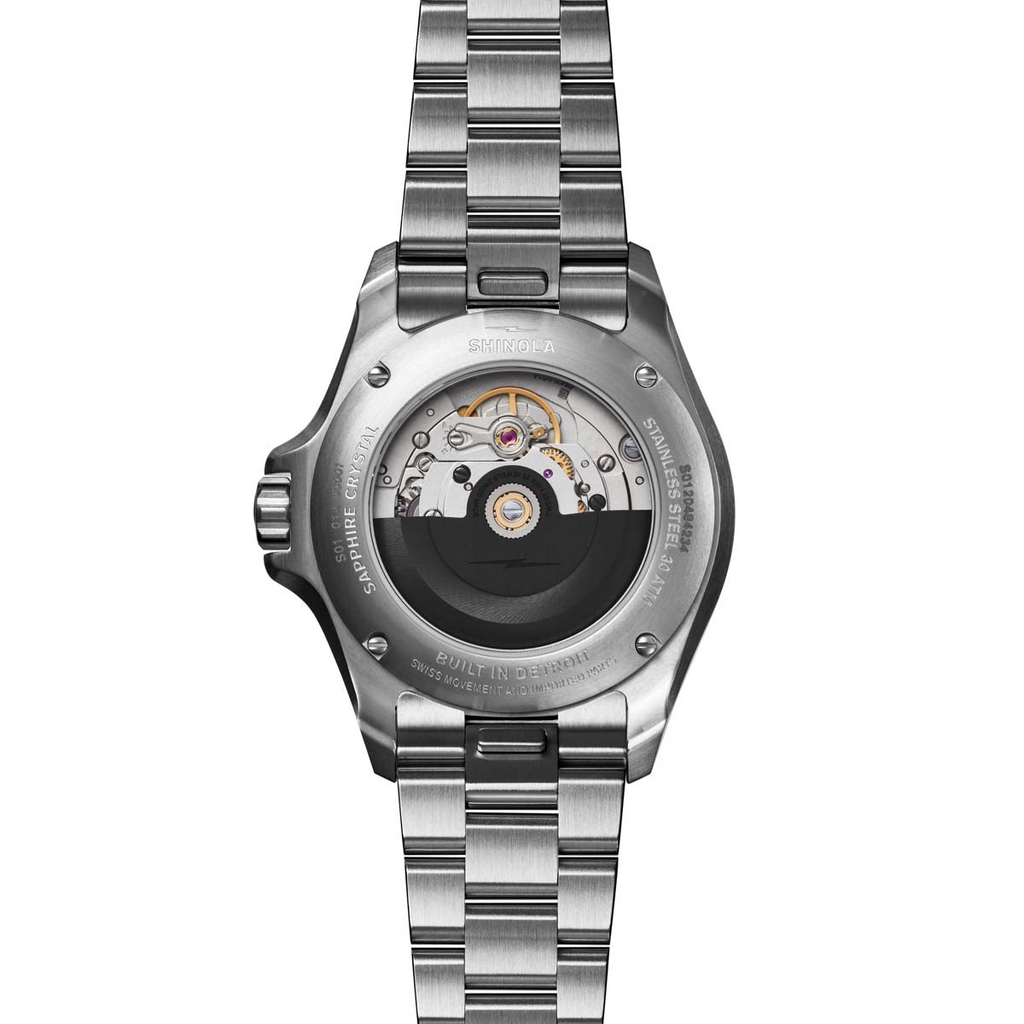 Stainless steel automatic watch back view.