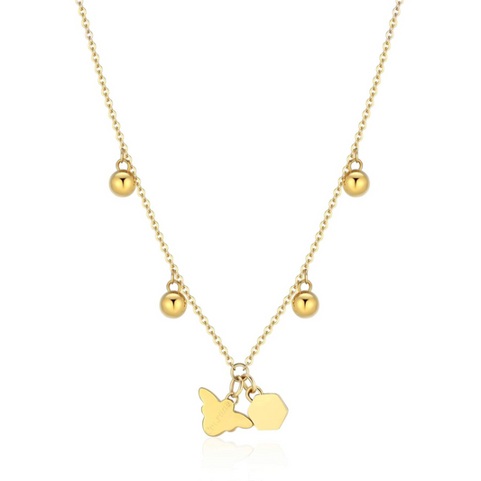 Stainless steel yellow pendant necklace with charms.