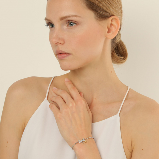 Stainless steel bangle with simulated diamonds.
