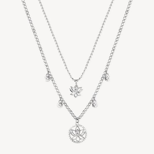 Multi-strand necklace with simulated diamond pendants.