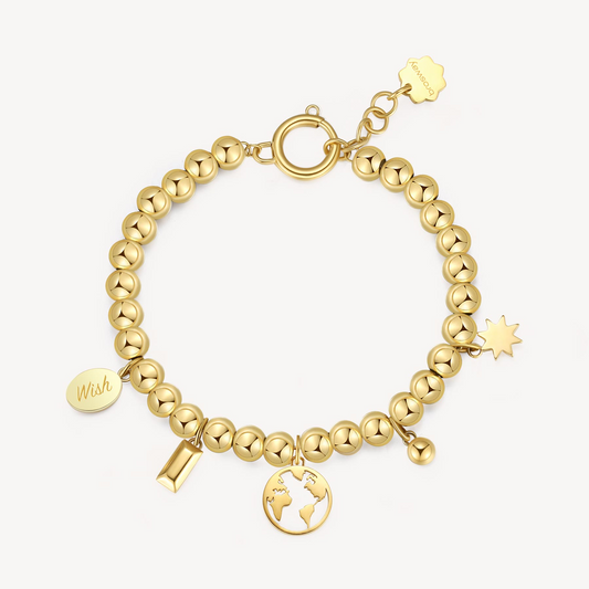 Yellow stainless steel bracelet with globe charm.