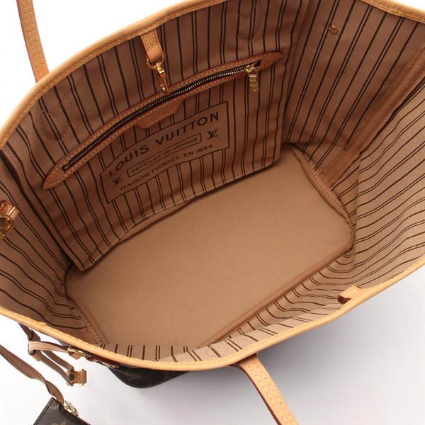 Brown leather handbag with striped interior.