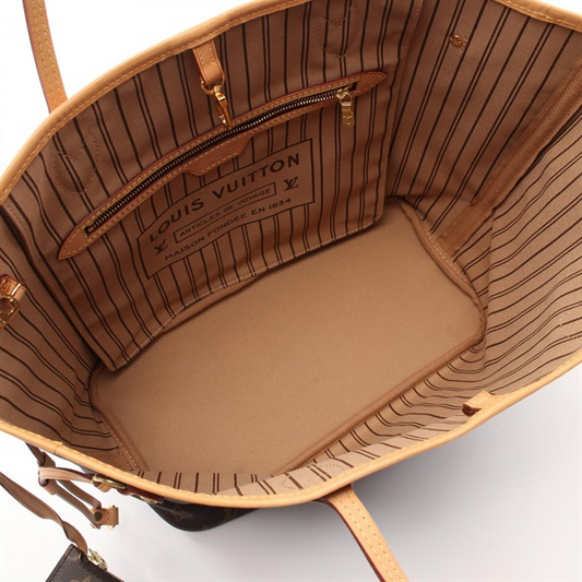 Brown leather handbag with striped interior.