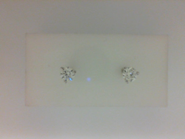 Round diamond stud earrings in white gold.
