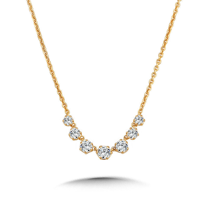 Yellow gold necklace with round diamonds.