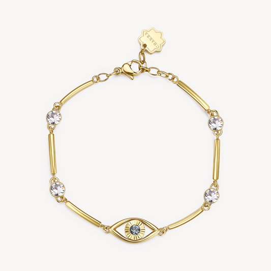 Yellow bracelet with blue and clear crystals.