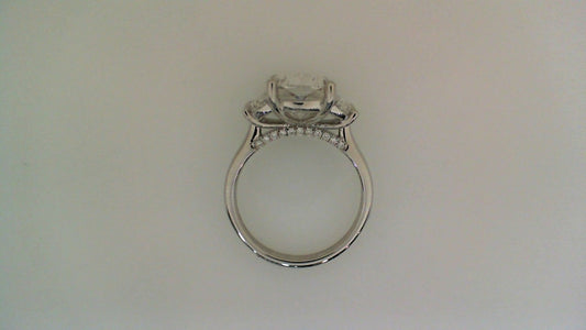 Three-stone cushion diamond engagement ring.