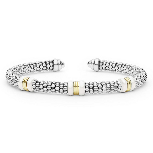 Sterling silver cuff with gold accents.