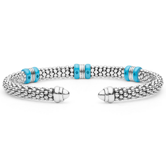 Sterling silver cuff with turquoise ceramic accents.