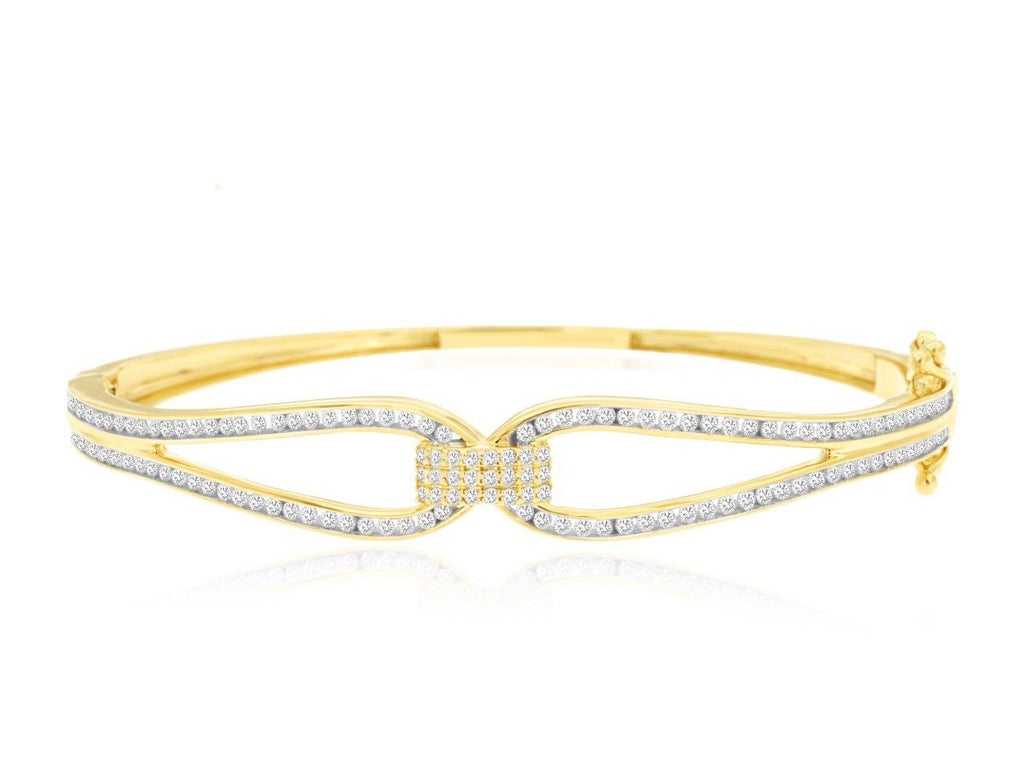 Yellow gold bangle with round diamonds.