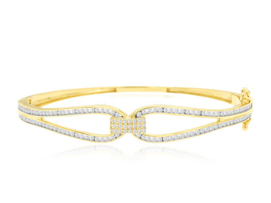 Yellow gold bangle with round diamonds.