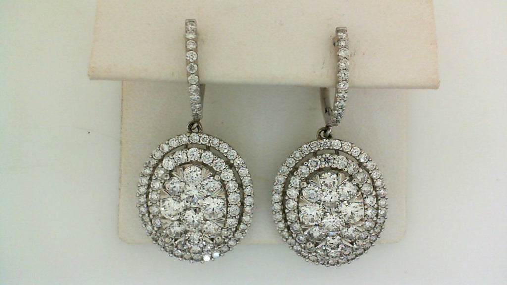 Round diamond drop earrings, white gold setting.