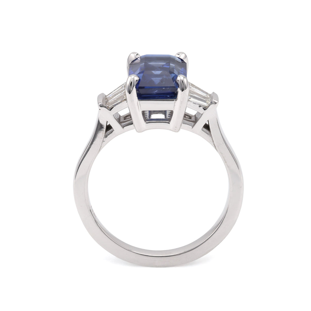 Emerald sapphire ring with baguette diamonds.