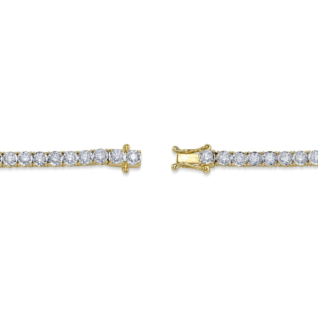 Yellow gold bracelet with round diamonds.