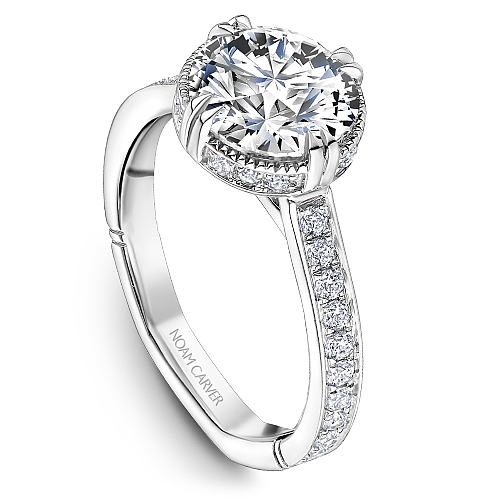 Vintage halo diamond ring in white gold.