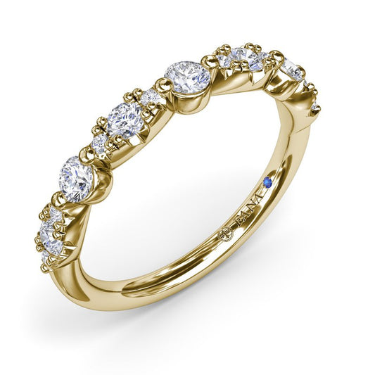 Yellow gold band with various shaped diamonds.