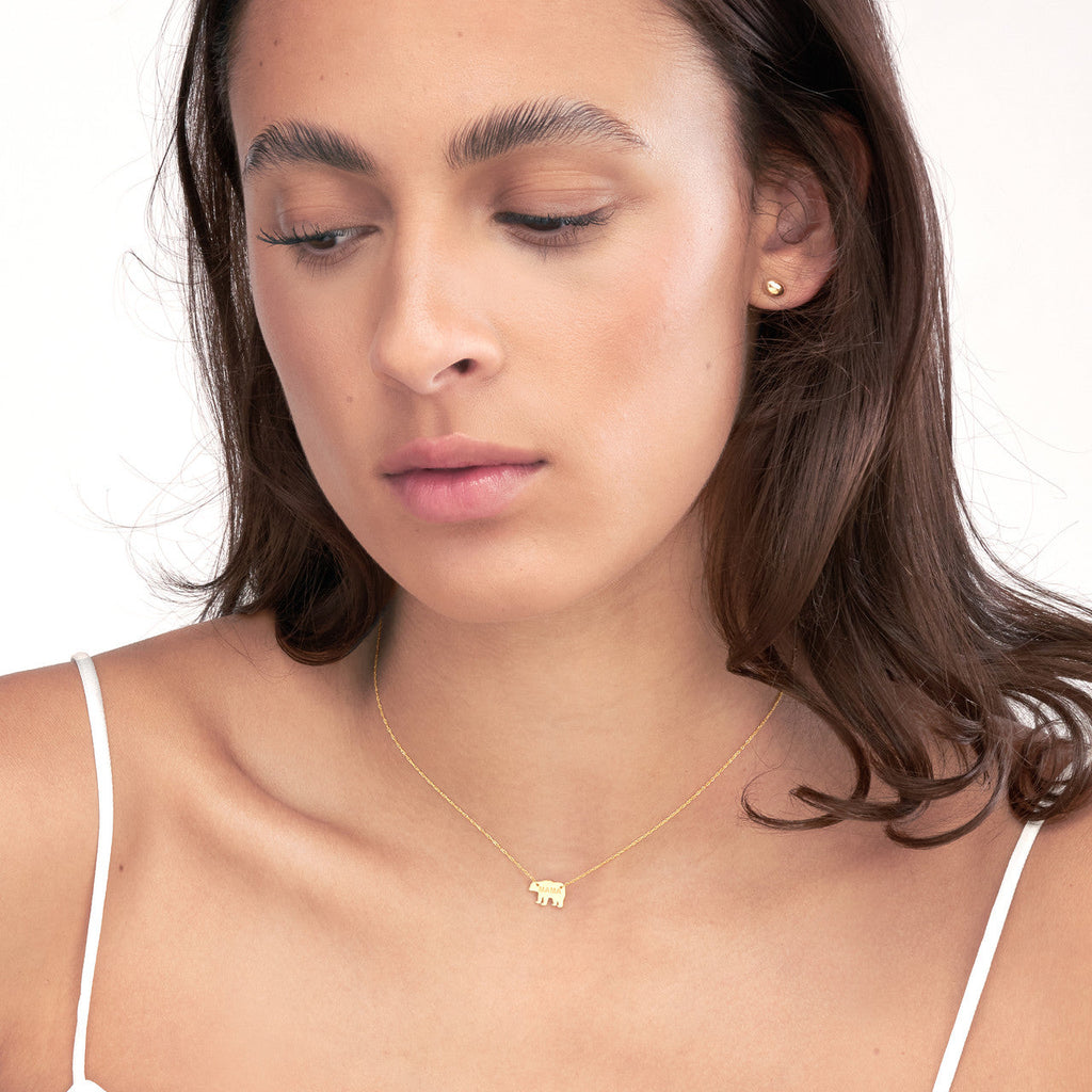 14K yellow gold elephant pendant necklace.
