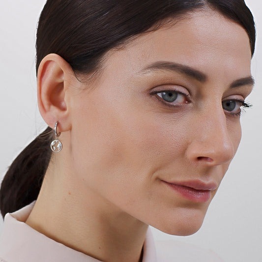 Yellow stainless steel drop earrings with simulated diamonds.
