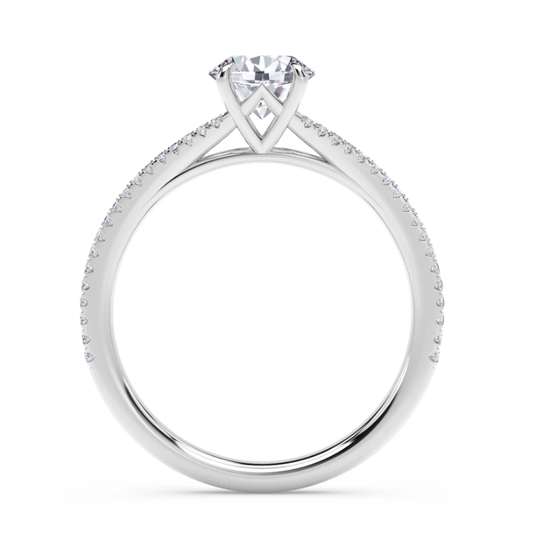 Platinum ring with round diamond and side stones.
