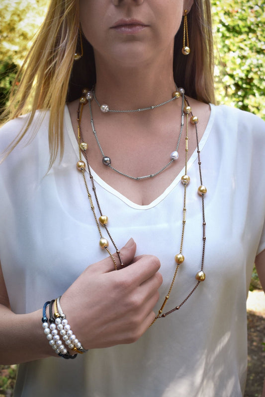 Stainless steel necklace with South Sea pearls and gemstones.