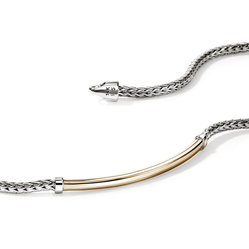 Sterling silver bracelet with yellow gold accent.