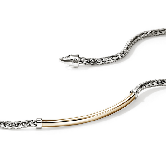 Sterling silver bracelet with yellow gold accent.