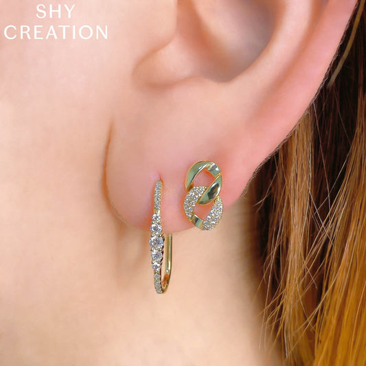 14K yellow gold diamond oval hoop earrings.