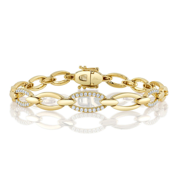 Yellow gold bracelet with diamond-accented links.