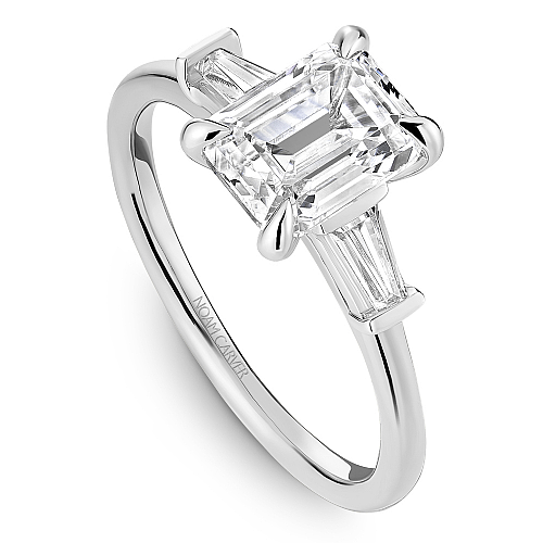 Three-stone diamond ring with baguettes.