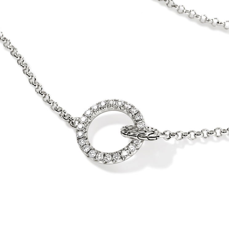 Sterling silver circle necklace with diamonds.