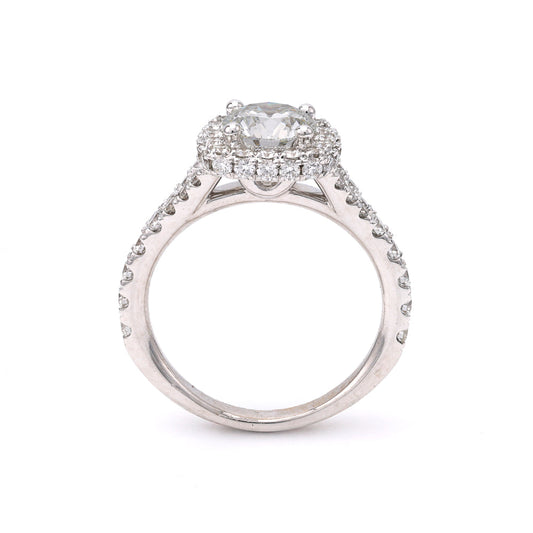18K white gold diamond halo ring.