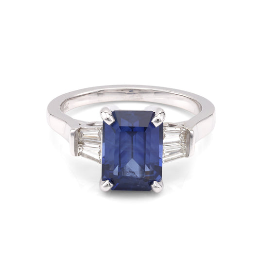 Emerald-cut sapphire ring with baguette diamonds.