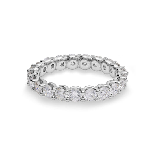 Platinum band with round diamonds.