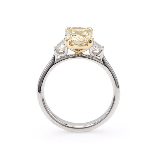 Three-stone yellow diamond engagement ring.