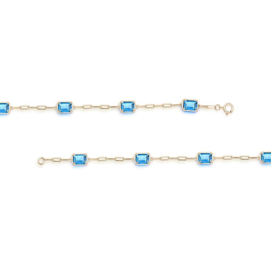 Emerald Blue Topaz bracelet, yellow gold paperclip design.