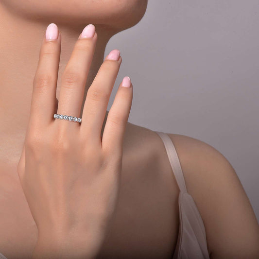 Simulated diamond band on woman's finger.