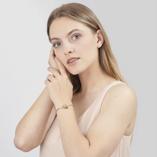 Stainless steel bangle, white-yellow blend.